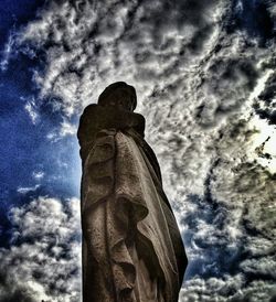 Low angle view of statue against cloudy sky