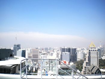 High angle view of city buildings against sky