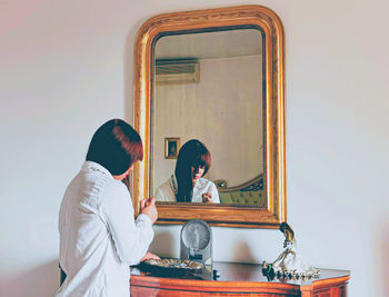 Reflection of woman in mirror