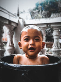 Portrait of cute boy in bathtub