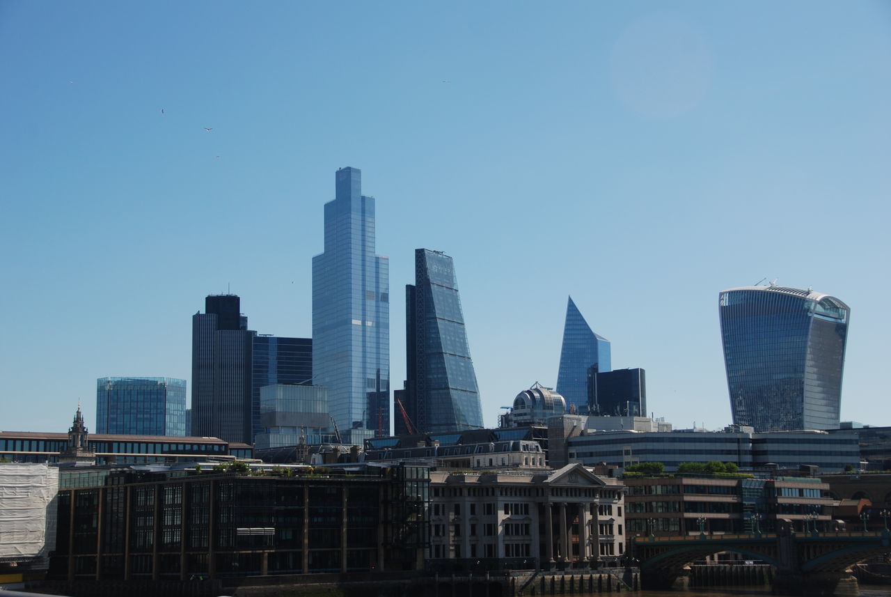 MODERN BUILDINGS AGAINST CLEAR SKY