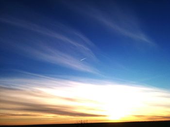 Airplane flying against sky