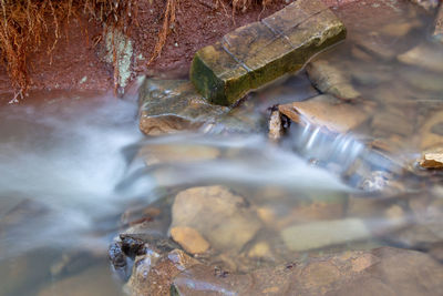 Close-up of water flowing through rocks