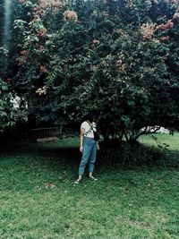 Full length of woman standing on field