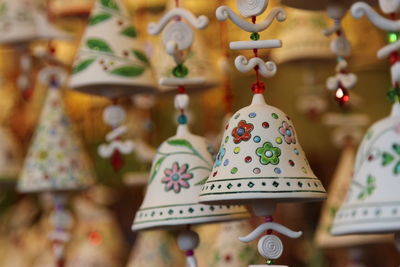 Close-up of decorations hanging for sale in store