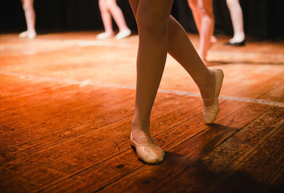 Low section of ballet dancers performing on stage