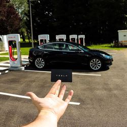 Man driving car on road in city