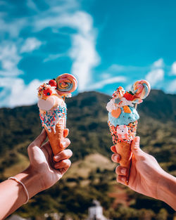 Close-up of hand holding ice cream