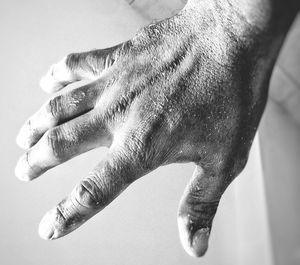 Cropped image of dirty hand