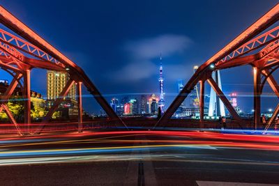 Light trails on suspension bridge at night