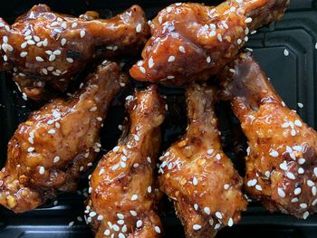 High angle view of meat on barbecue grill