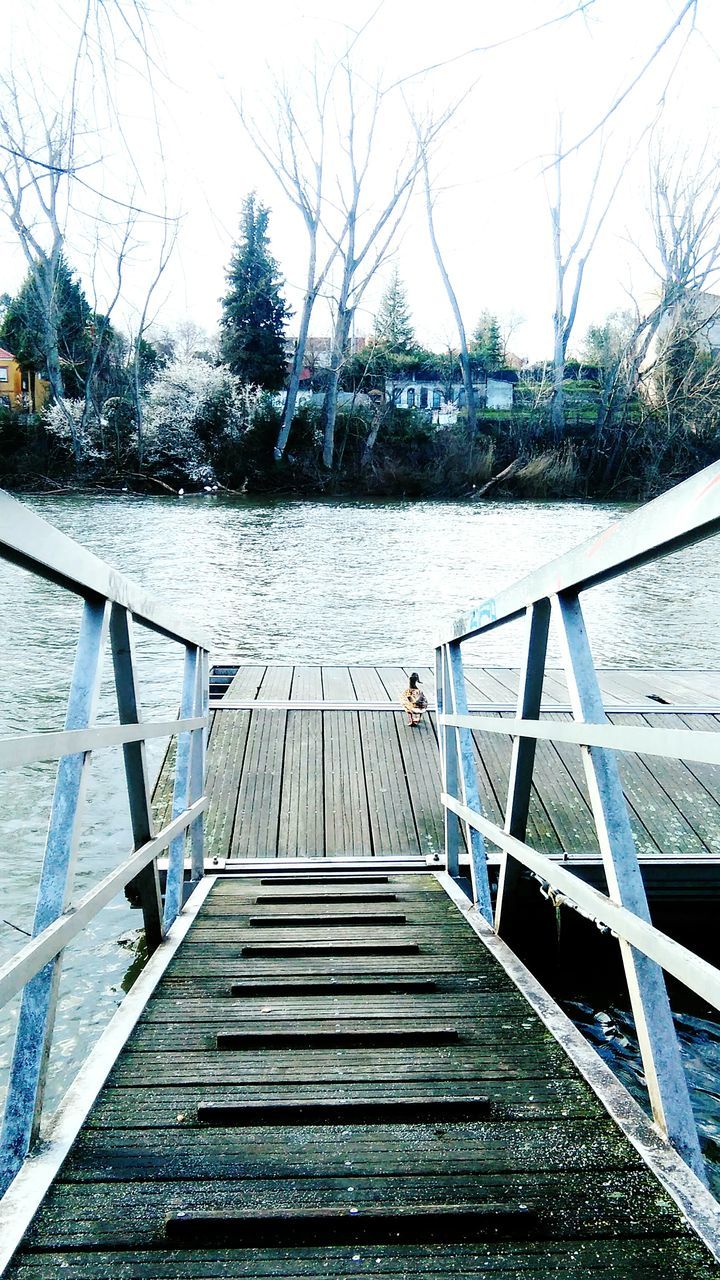 railing, the way forward, water, built structure, wood - material, architecture, footbridge, sky, pier, boardwalk, diminishing perspective, steps, day, nature, wood, tranquility, wood paneling, clear sky, river, outdoors