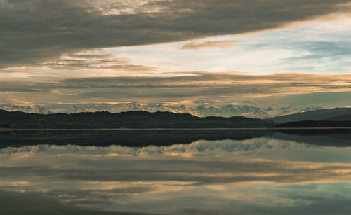 Scenic view of lake against sky during sunset