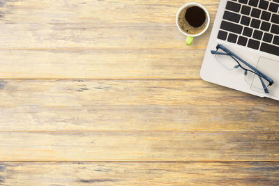 High angle view of coffee cup on table