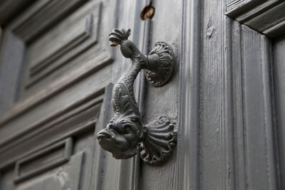 Close-up of sculpture on door