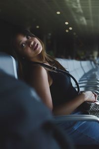 Portrait of woman sitting in car