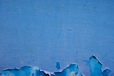 Close up shot of blue old metal door texture background