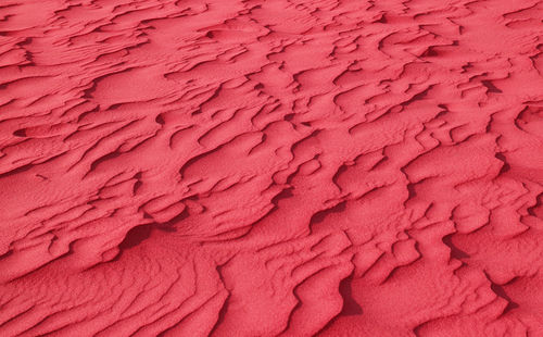 Surreal pop art style red colored desert sand ripple patterns for background or banner