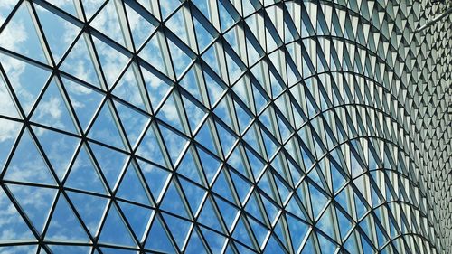 Low angle view of steel glass ceiling closeup. full framed symmetry repeating pattern background