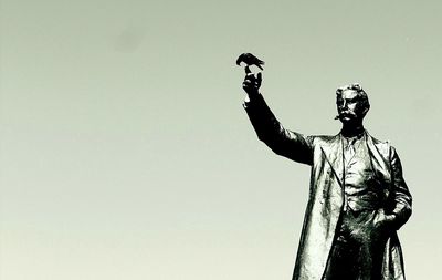 Low angle view of statue against clear sky