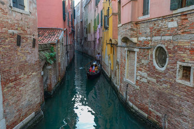 Canal amidst buildings in city