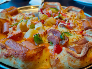 Close-up of pizza served in plate