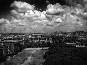 Buildings against cloudy sky