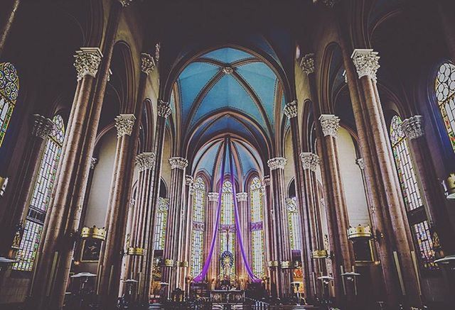 indoors, arch, architecture, place of worship, religion, built structure, spirituality, interior, church, ceiling, architectural column, low angle view, famous place, cathedral, travel, history, tourism, travel destinations