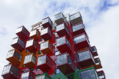 Low angle view of building against cloudy sky