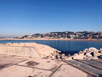 Scenic view of sea against clear blue sky