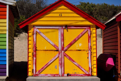 Multi colored yellow umbrella on building