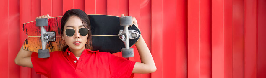 Portrait of woman with red umbrella