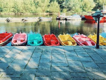 Multi colored moored boats in lake