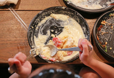 High angle view of woman preparing food on table