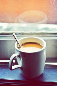 Close-up of coffee cup on table