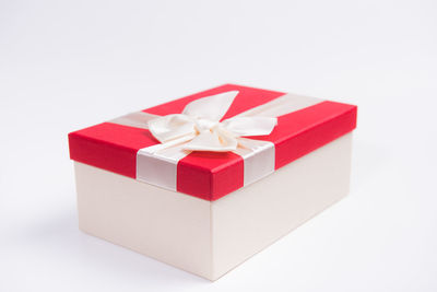 Close-up of gift against white background
