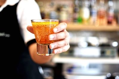 Close-up of woman holding cocktail