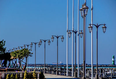 Street lights against sky