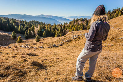 Rear view of man looking at mountains