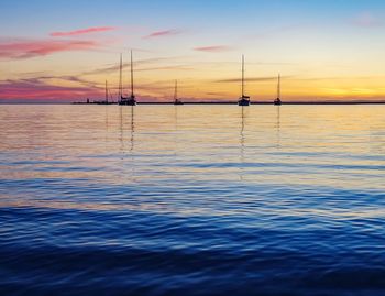 Scenic view of sea against sky at sunset