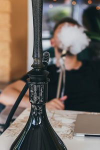 Man smoking hookah at home