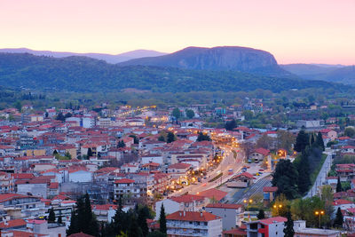 High angle shot of townscape against sky at sunset