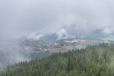 Panoramic view of mountains against sky during foggy weather