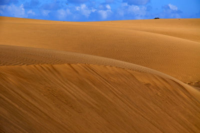 Scenic view of desert against sky