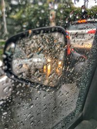 Close-up of wet car windshield during rainy season