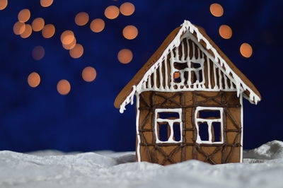 Close-up of gingerbread house on table during christmas