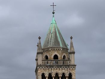 Low angle view of bell tower against sky