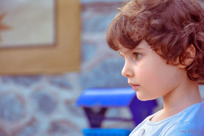 Portrait of cute boy looking at home