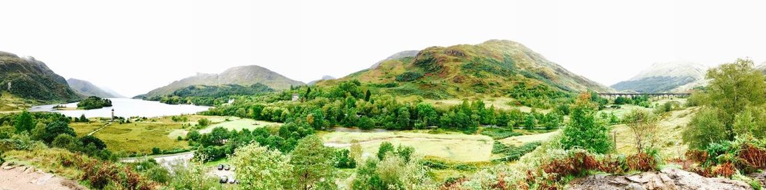 Panoramic view of landscape and mountains against clear sky