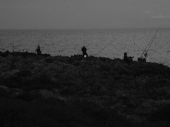 Scenic view of calm sea at sunset